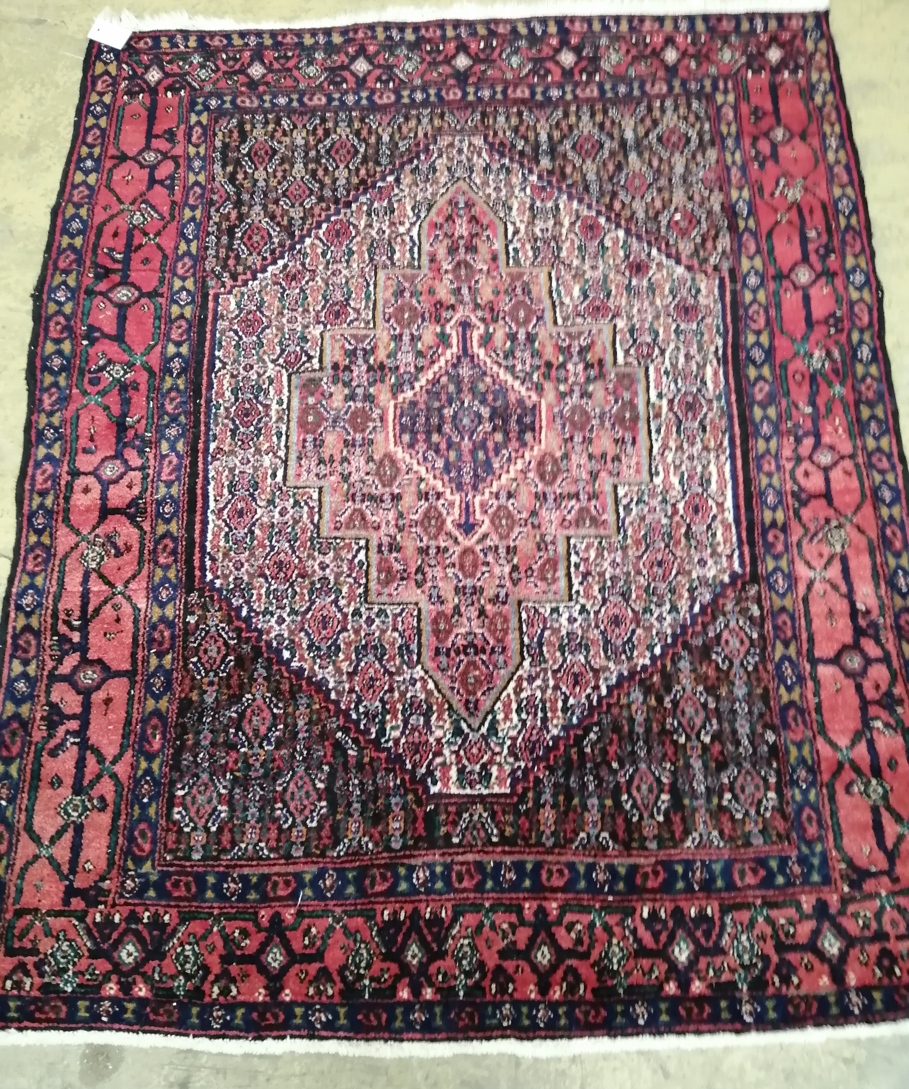 A North West Persian blue ground rug 142cm x 117cm.